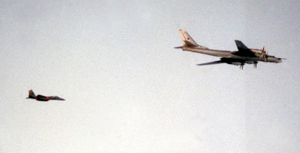 A US Air Force F-15 Eagle escorting a Russian Tu-95 Bear-H