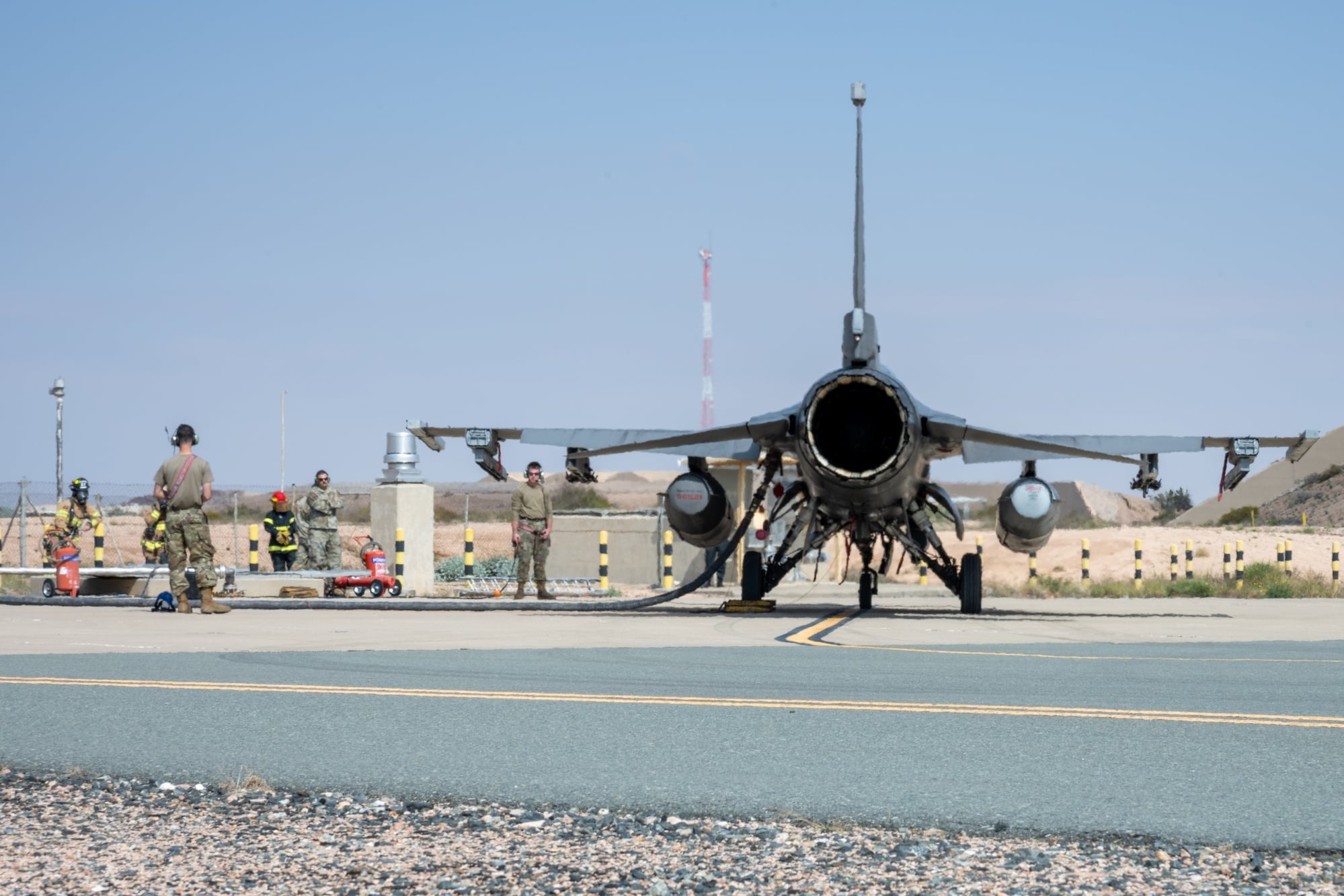 An F-16 being hot pit refuelled during an agile combat employment exercise
