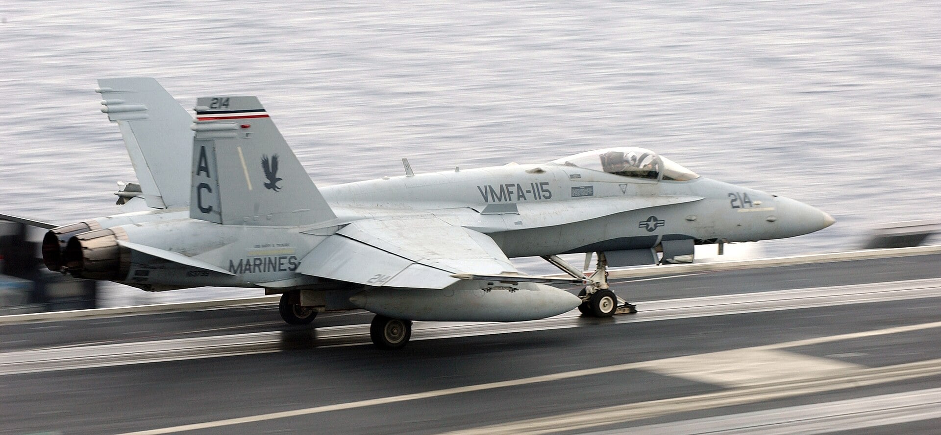 F/A-18A+ Hornet launching from a steam catapult aboard a Nimitz-class carrier