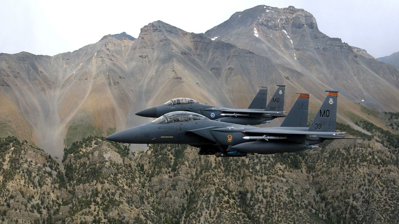 F-15E Strike Eagles on a low-level training mission over the Sawtooth Range Two US Air Force F-15E Strike Eagles flying low over the Sawtooth Mountain Range in Idaho