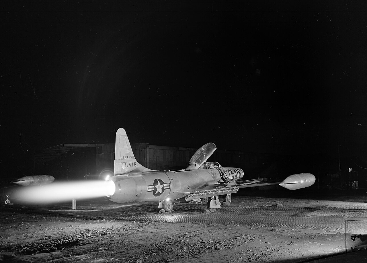 A fighter jet with afterburner lit; a compressor stall can throw its own flames and bangs