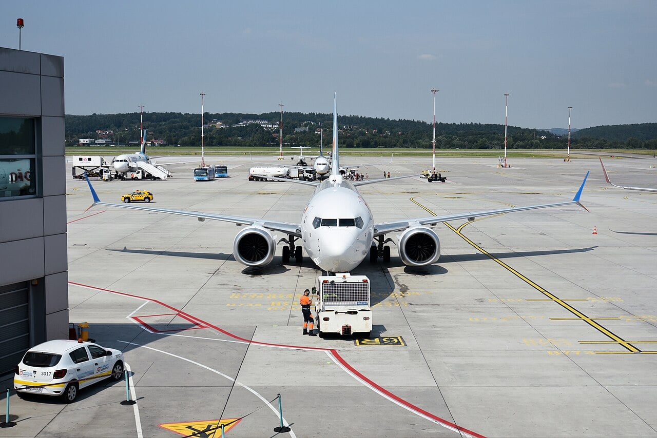 A flydubai Boeing 737 MAX being pushed back from a stand