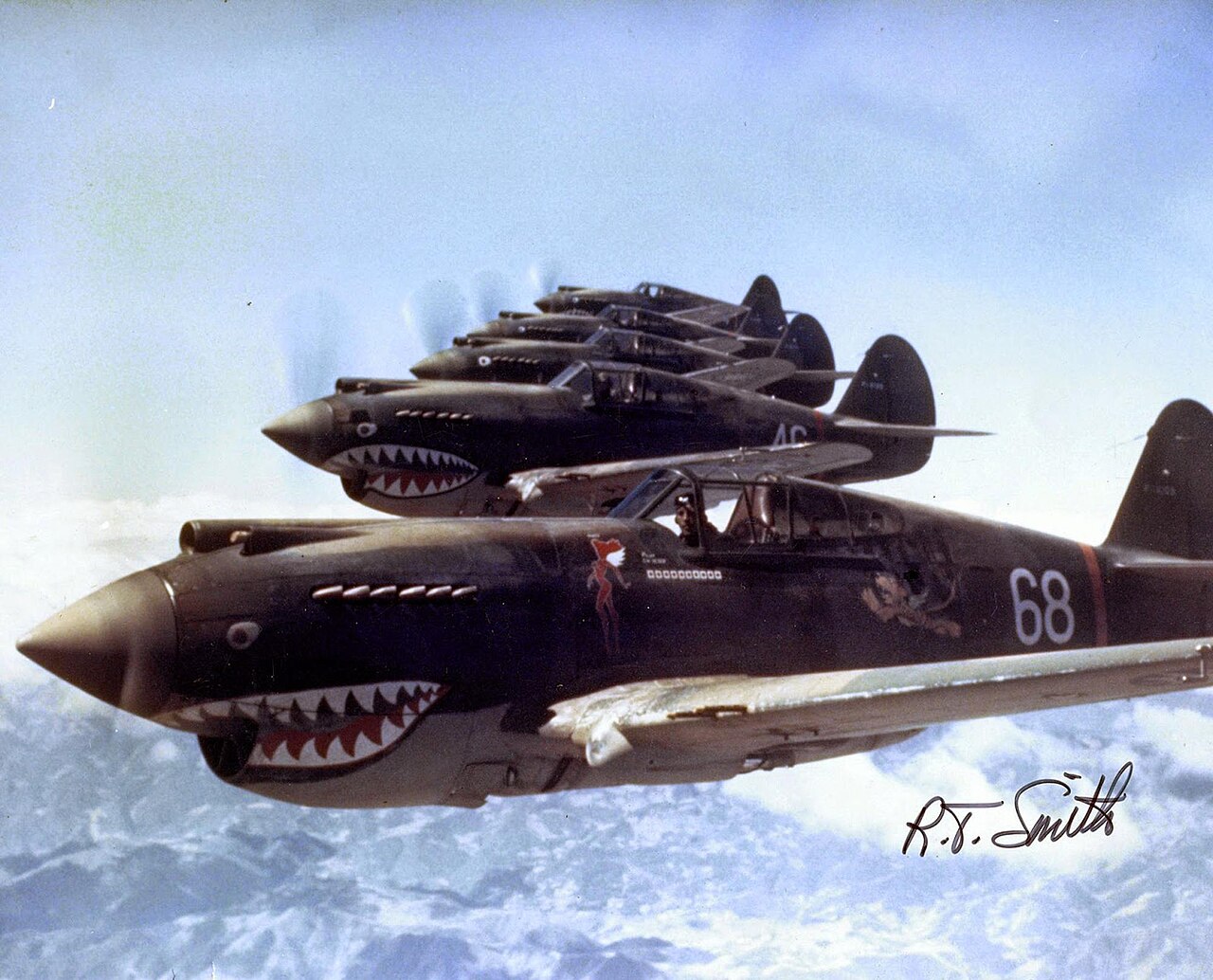 Flying Tigers Hells Angels P-40s over China 1942 Three P-40s of the AVG 3rd Squadron Hells Angels in echelon over China in 1942