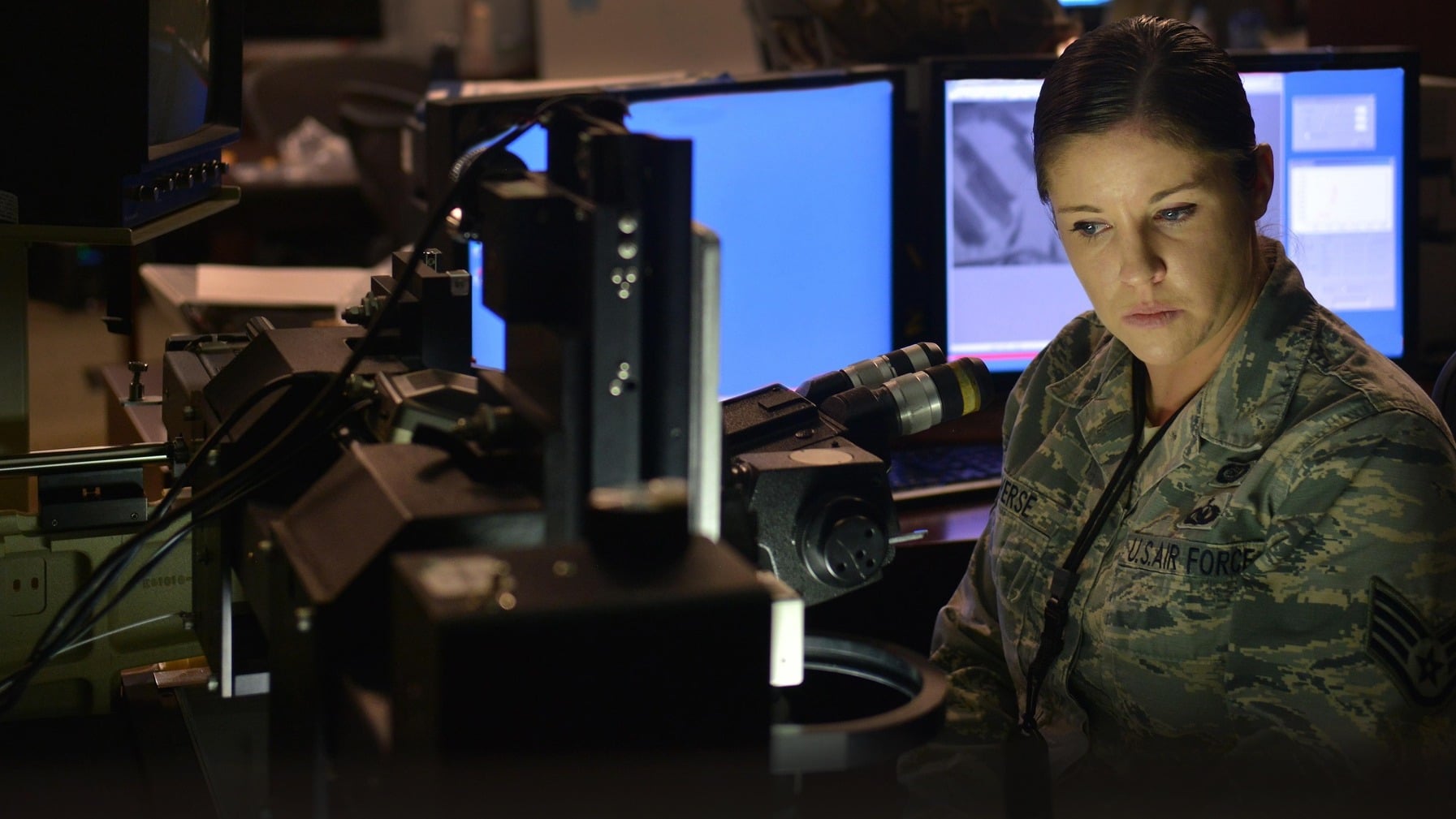Geospatial analyst reviews reconnaissance film at Beale AFB A US Air Force geospatial analyst reviews Optical Bar Camera film at Beale Air Force Base, California
