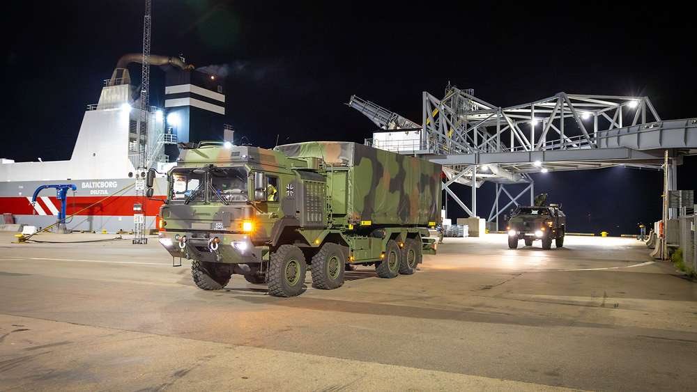 A German Army truck drives off a roll-on roll-off ferry at Visby harbour on Gotland at night during Exercise Silver Wotan 2026