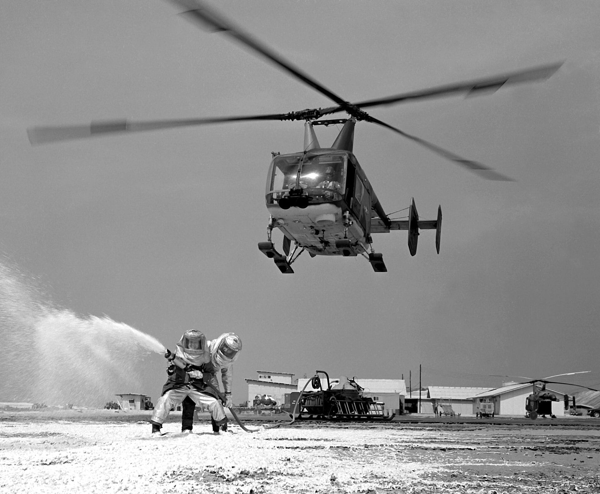 HH-43B Huskie hovering over firefighters at Cam Ranh Bay