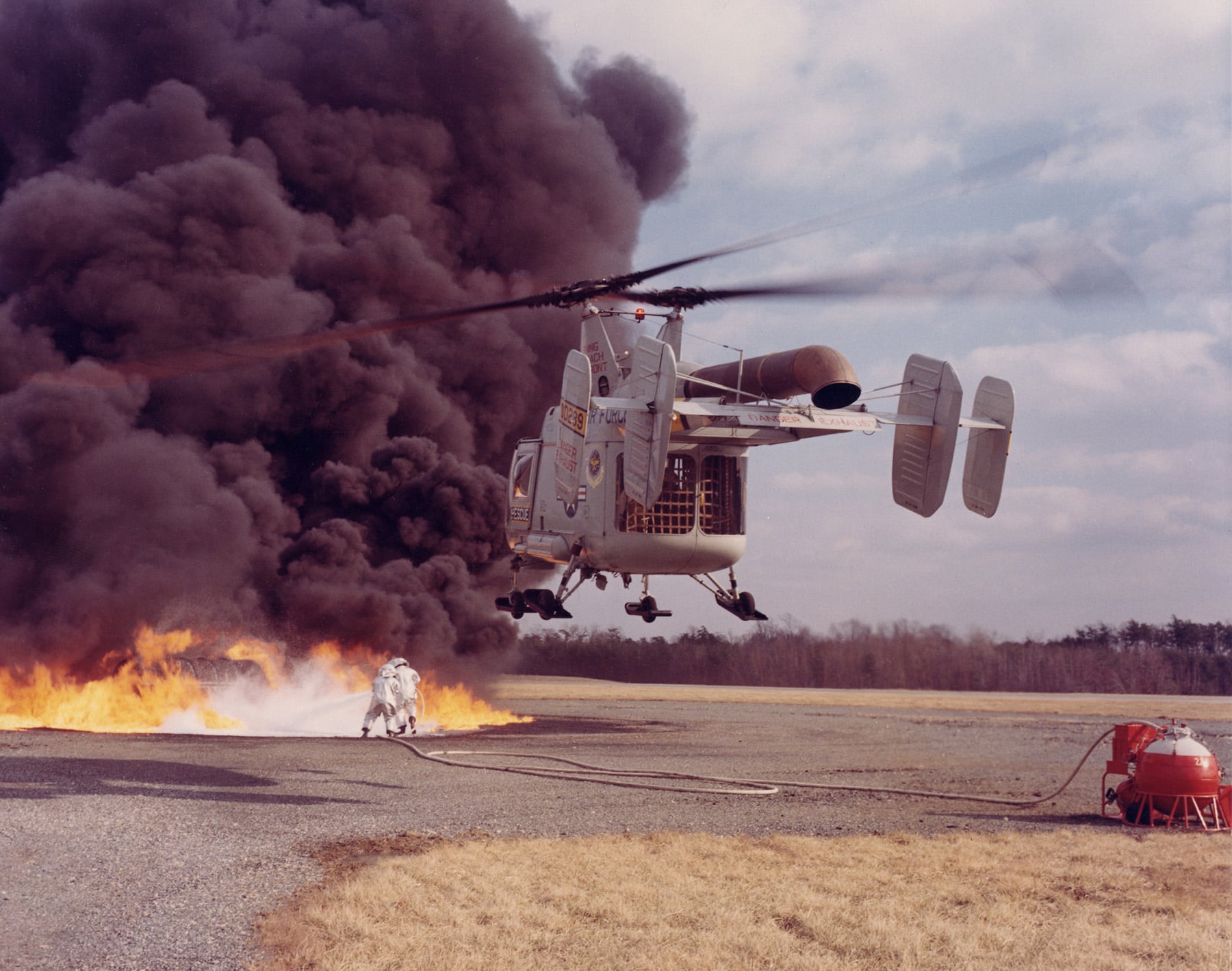 HH-43B Huskie hovering over a fire during a firefighting exercise