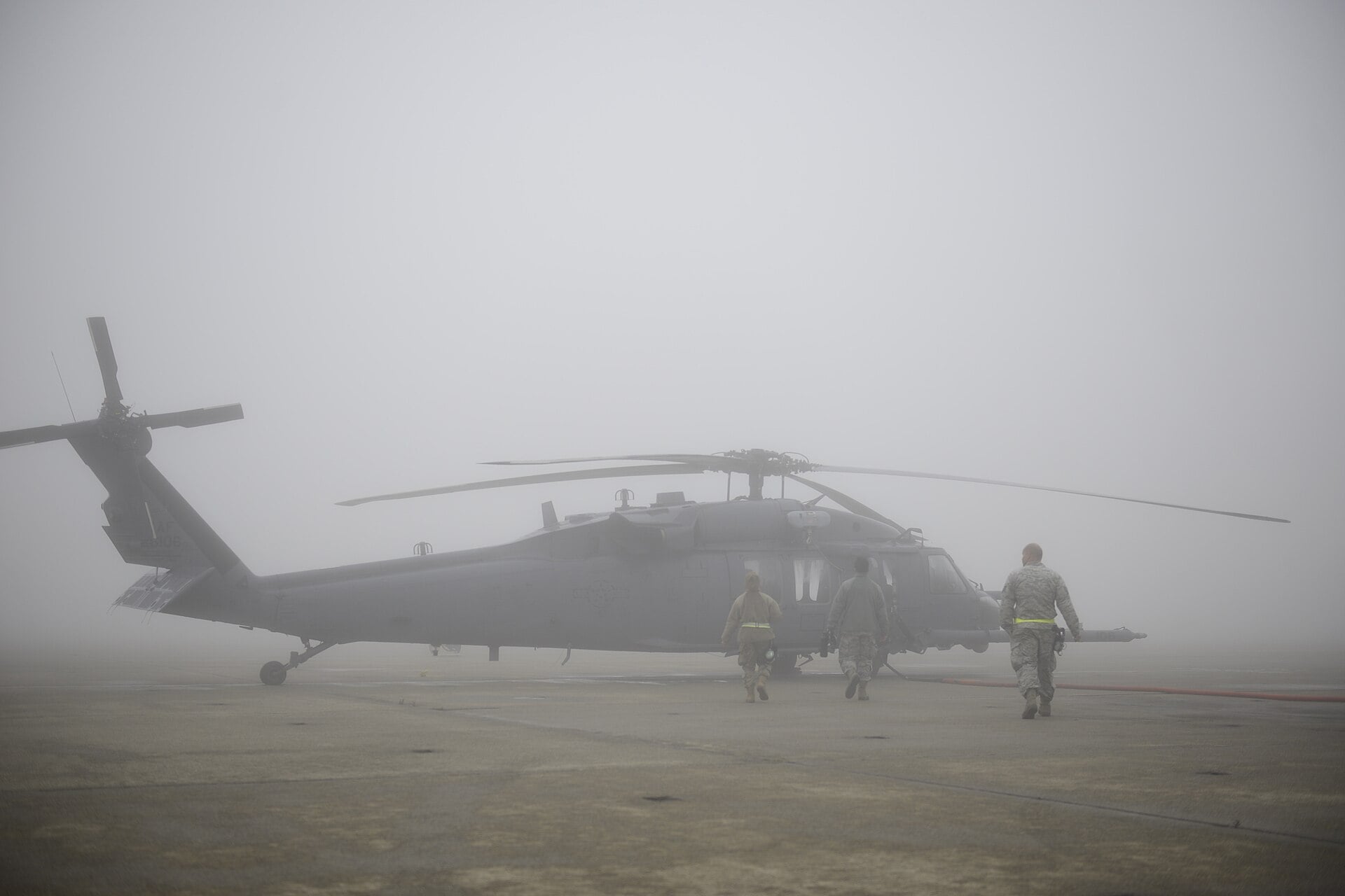 Pre-flight inspection of an HH-60G Pave Hawk at Moffett Air National Guard Base