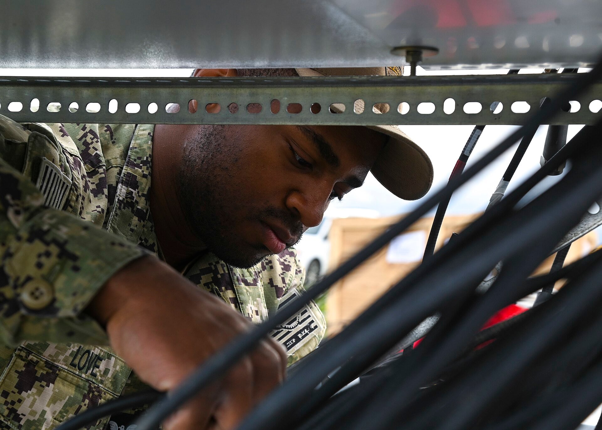 Technician installing Instrument Landing System equipment