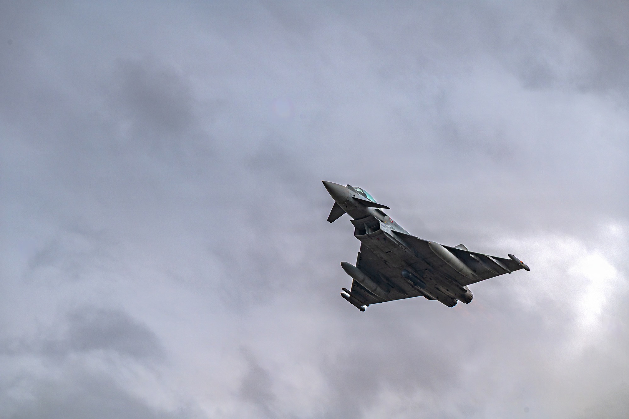Italian Air Force Eurofighter F-2000A banking on patrol carrying external fuel tanks