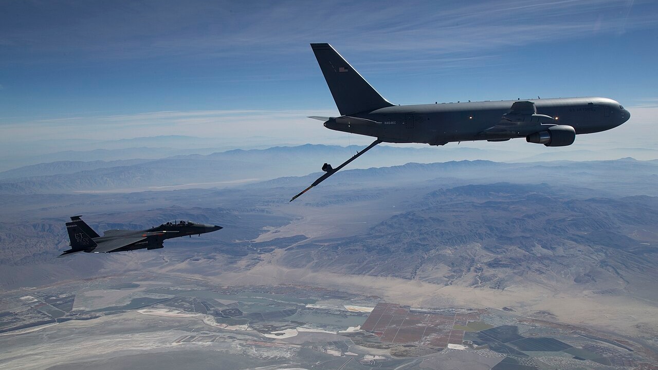 A KC-46A Pegasus refuelling an F-15E Strike Eagle in flight