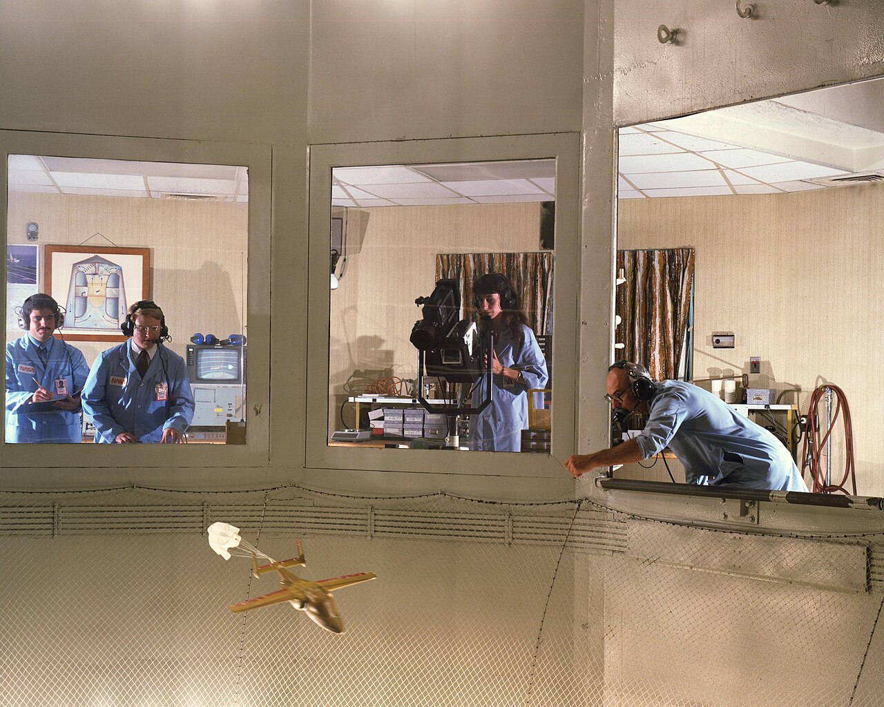 Spin recovery parachute test on a model in the NASA Langley 20-Foot Vertical Spin Tunnel