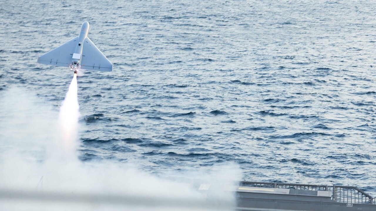 A low-cost one-way attack drone launching from the flight deck of a US Navy littoral combat ship