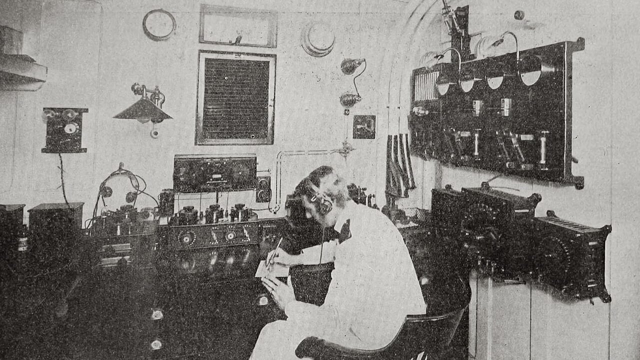 Marine wireless operator at the Morse key aboard SS Olympic, around 1912 A Marconi wireless operator wearing headphones writes down a message in the radio room of the liner SS Olympic