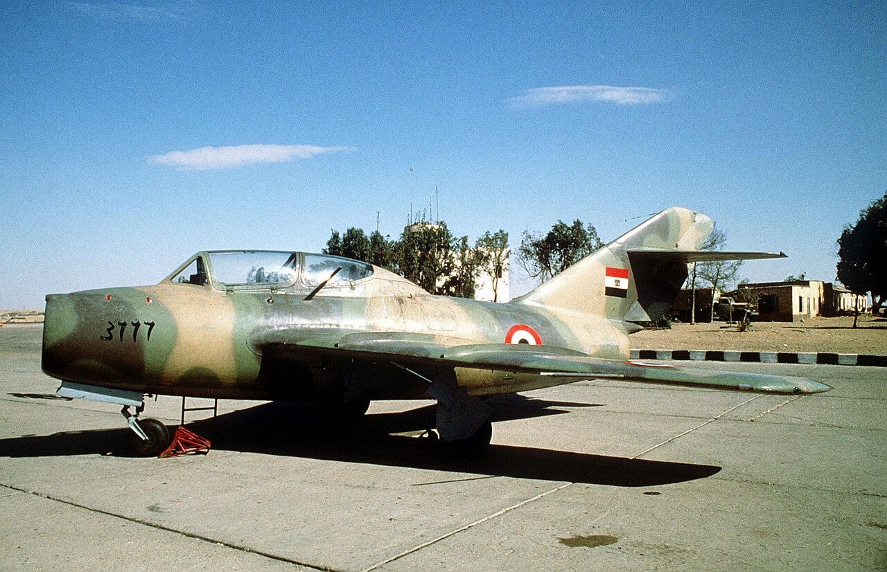 A Soviet-built MiG-15 fighter parked on an airfield