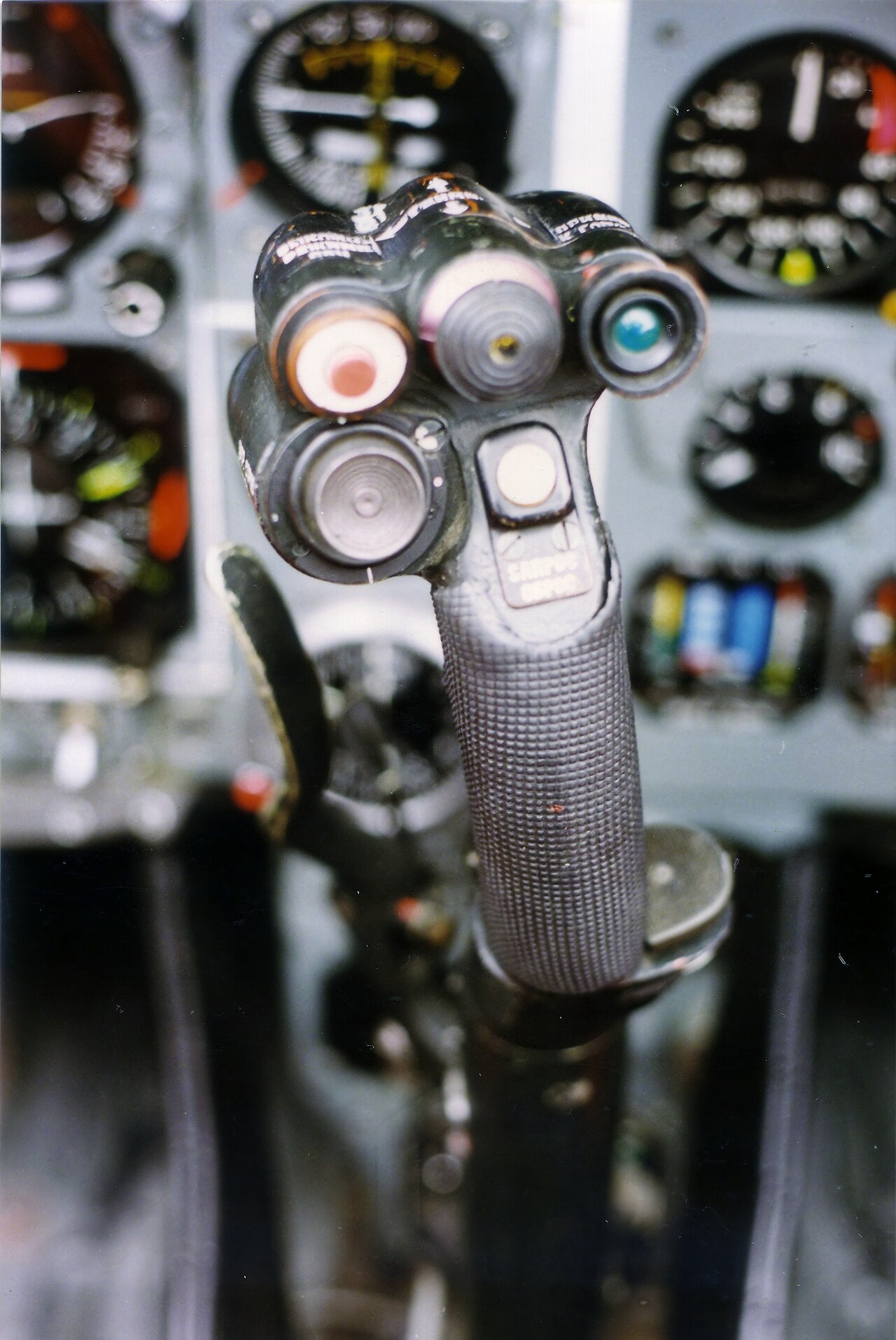 The cockpit of a Mikoyan MiG-29 Fulcrum showing the control stick and throttles