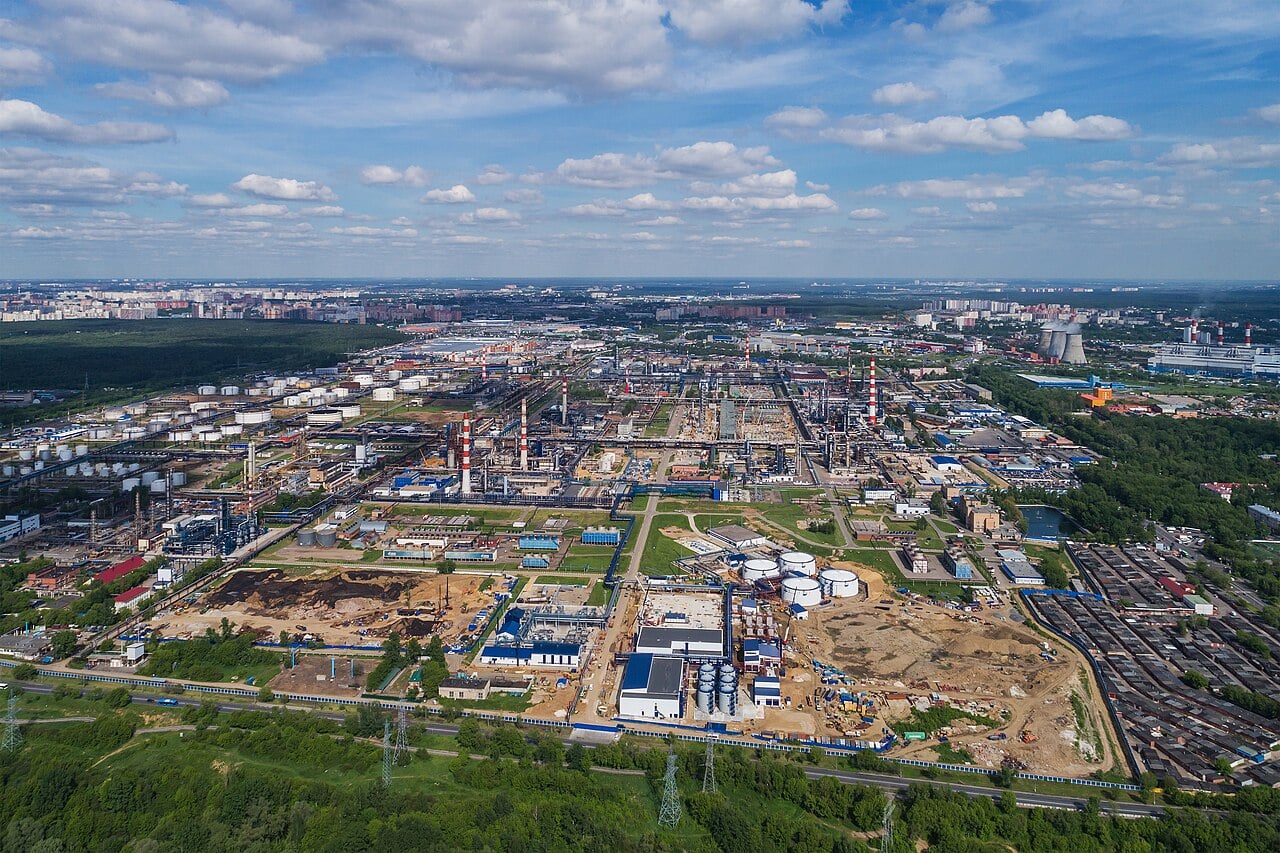 New high-rise residential blocks under construction beside the Moscow Refinery in June 2026