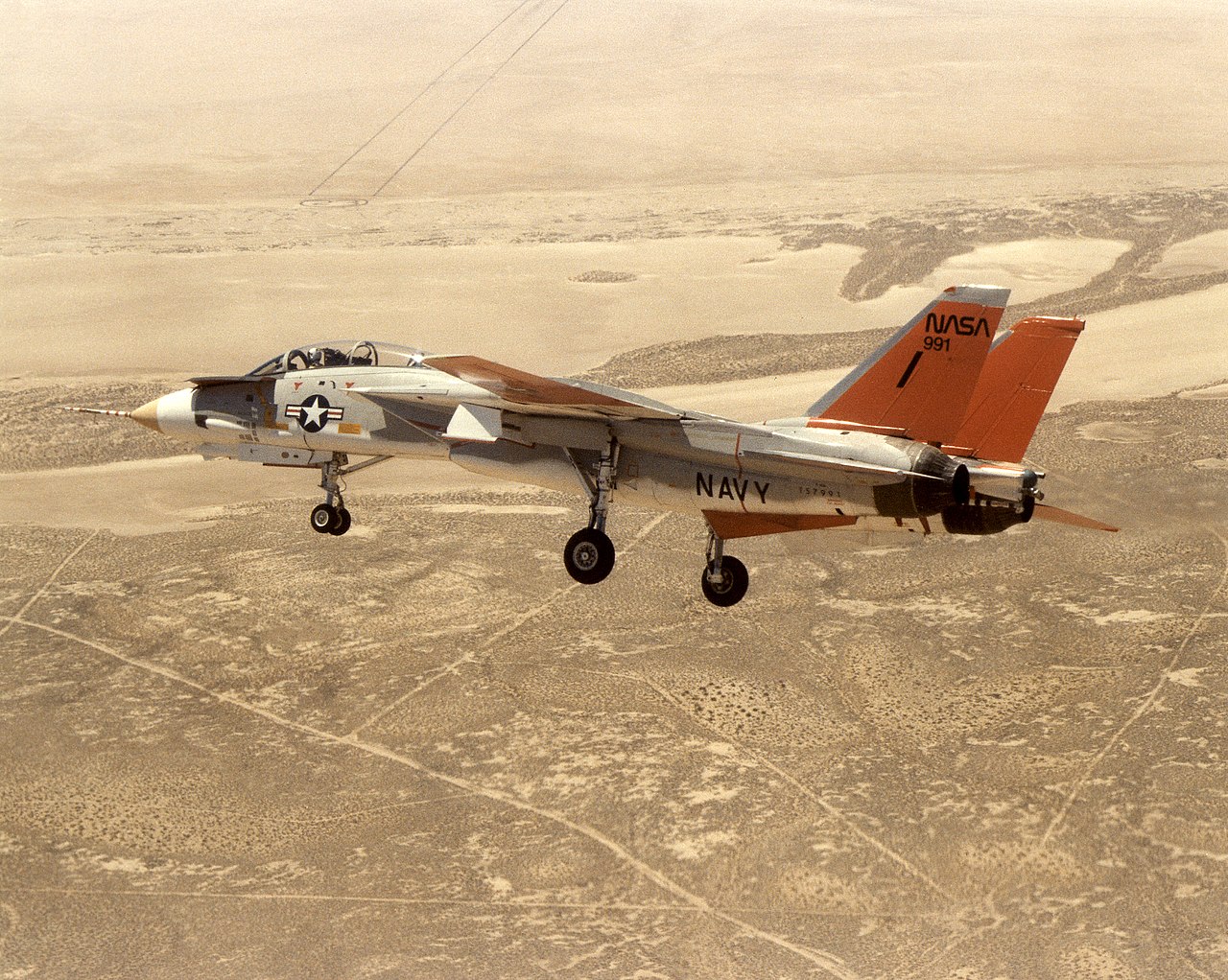 NASA 991, the F-14 spin research aircraft, in flight with its hydraulically actuated forebody canards extended
