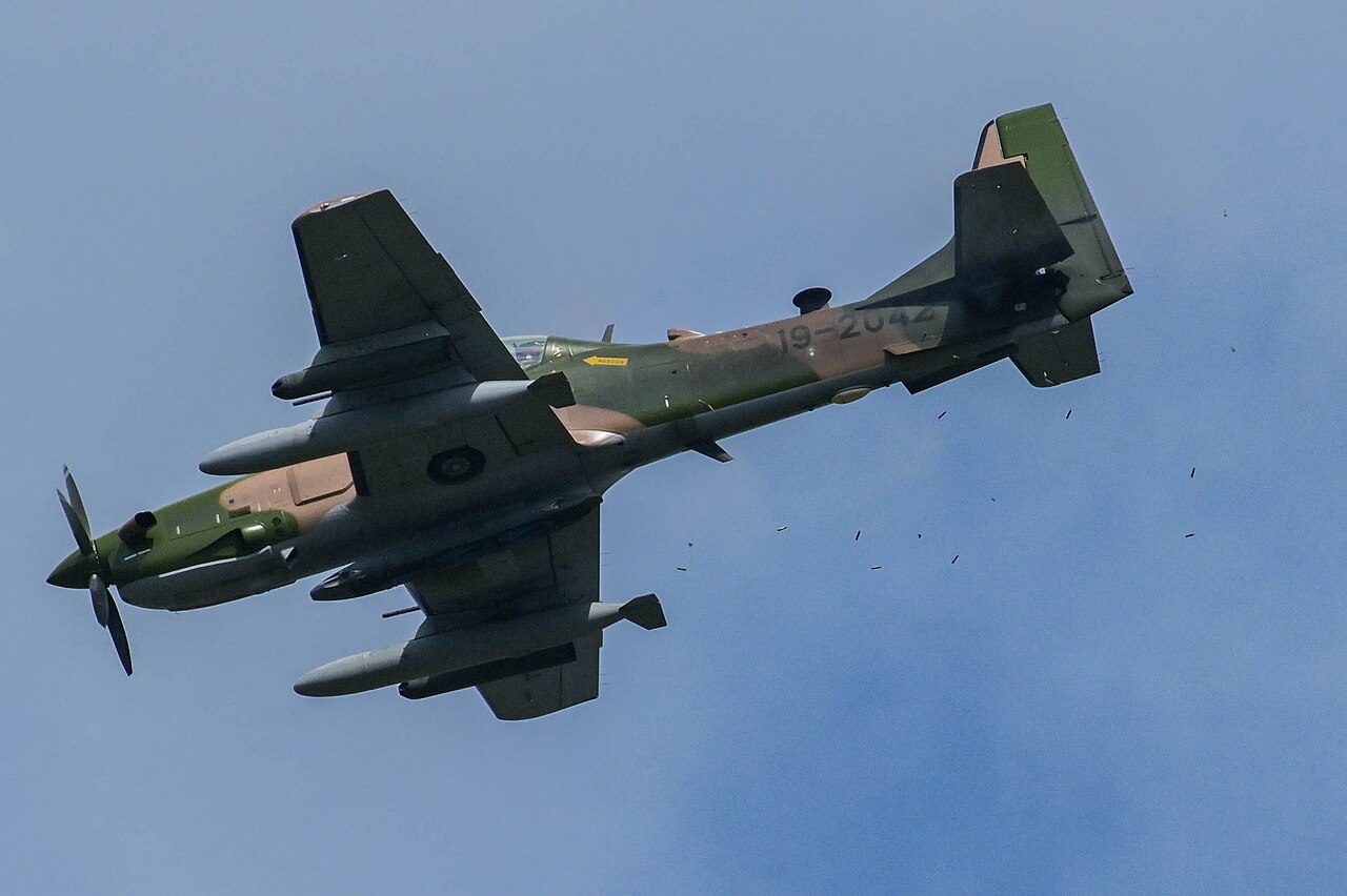 A Nigerian Air Force A-29 Super Tucano firing its .50-calibre machine guns in flight