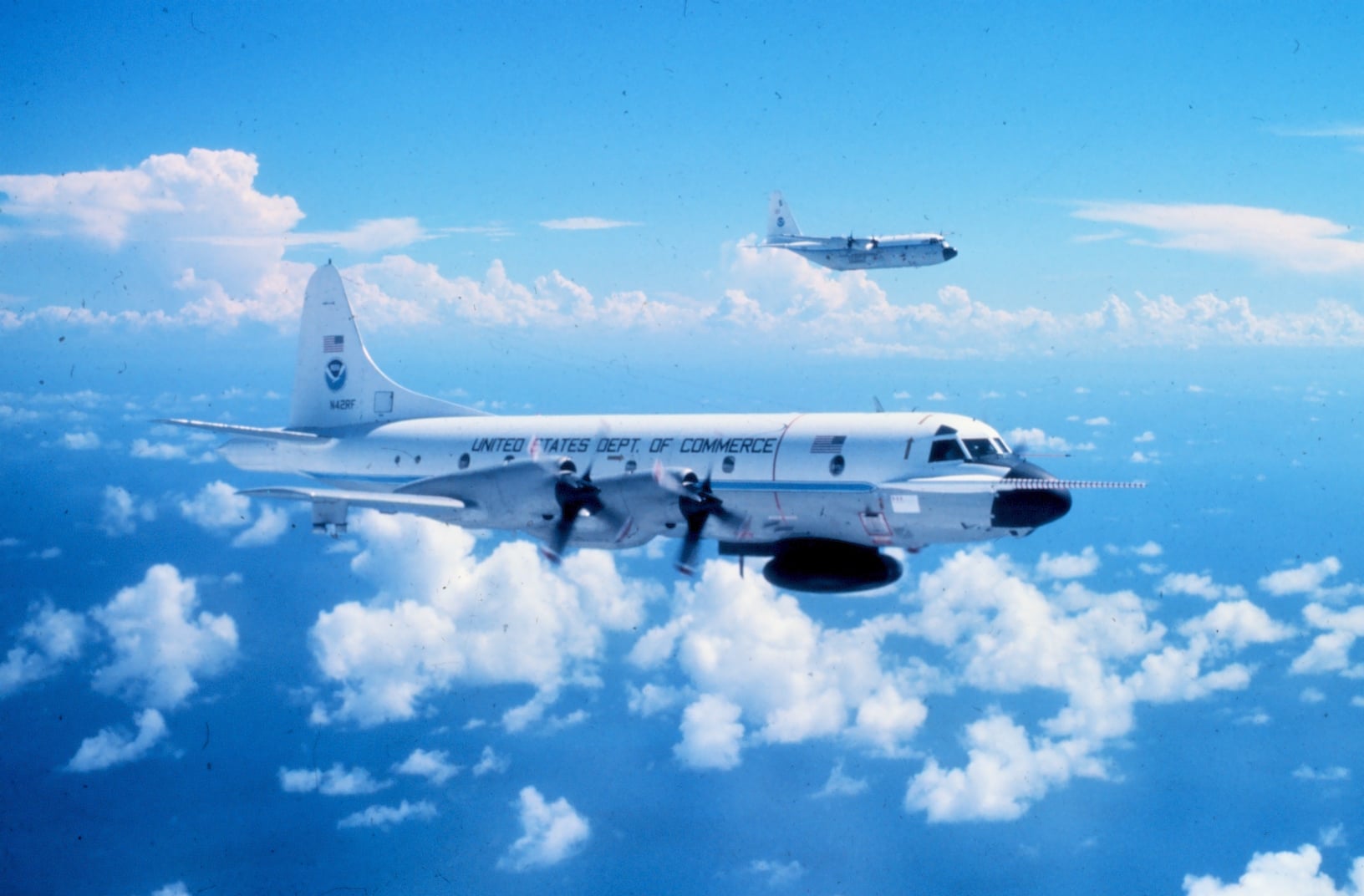 NOAA WP-3D Orion hurricane hunter N42RF Kermit in flight above clouds