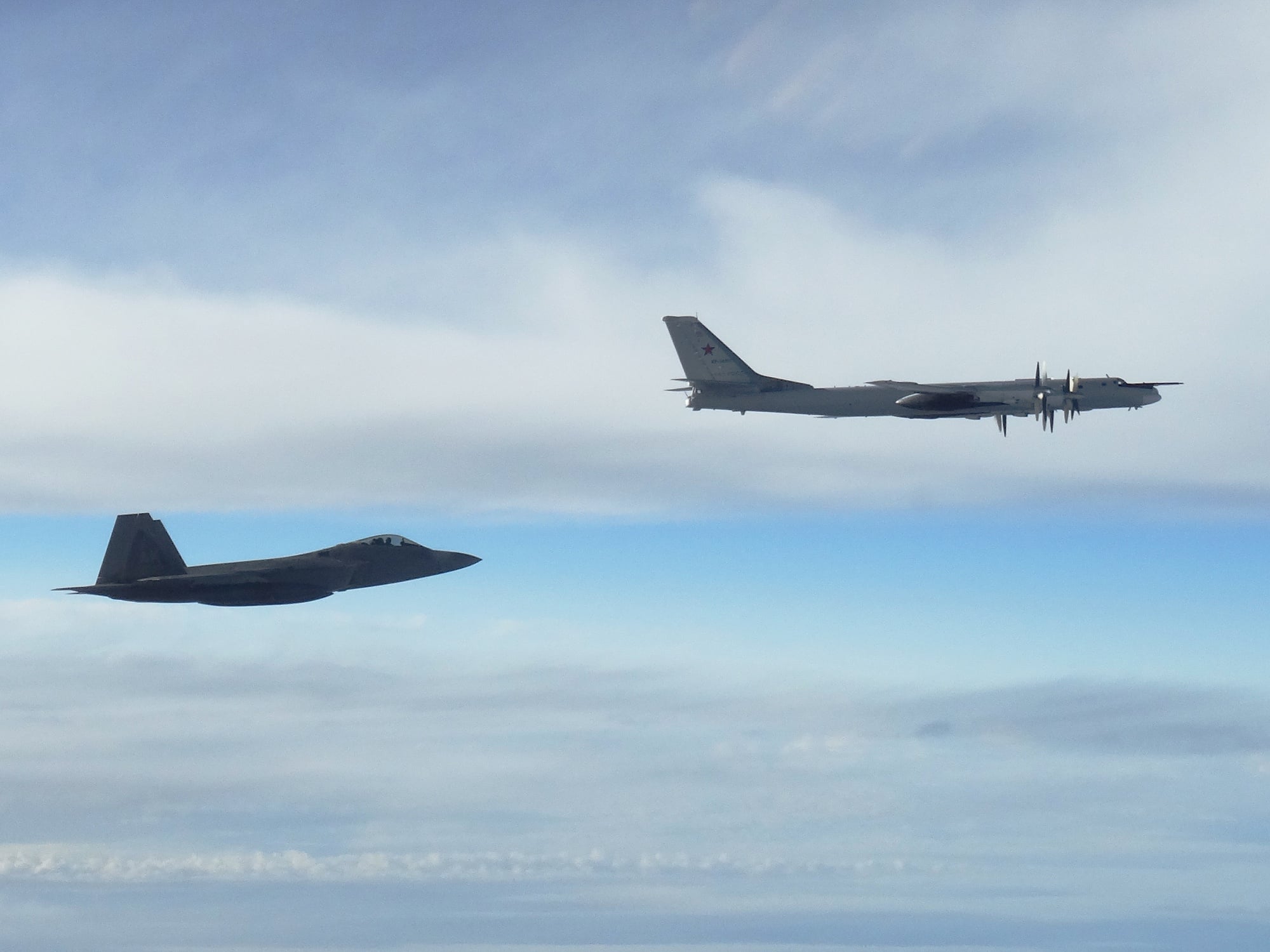 NORAD F-22 Raptors intercepting Russian Tu-95 Bear bombers NORAD F-22 Raptor fighters intercept Russian Tu-95 Bear bombers near the Alaskan air defence identification zone