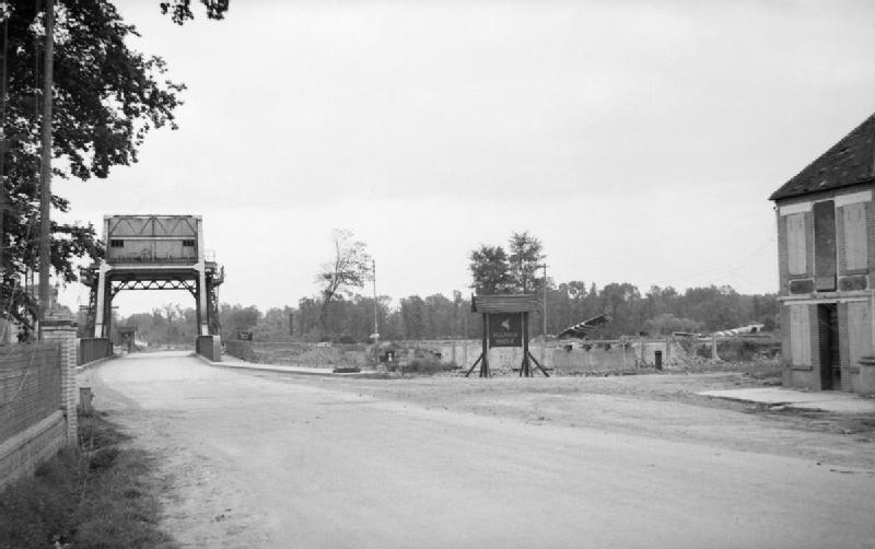 A view of Pegasus Bridge over the Caen Canal at Benouville in July 1944 with Horsa gliders in the background