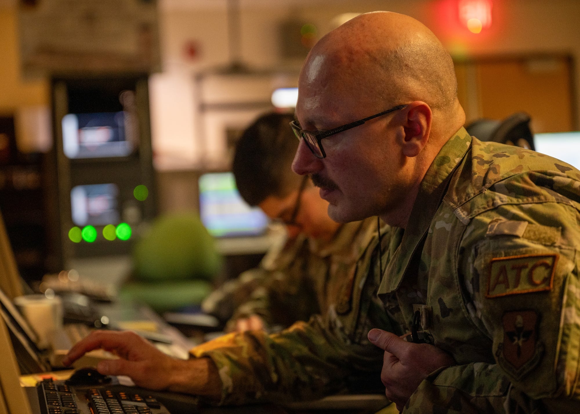 A radar approach control chief controller speaks to pilots at Laughlin Air Force Base