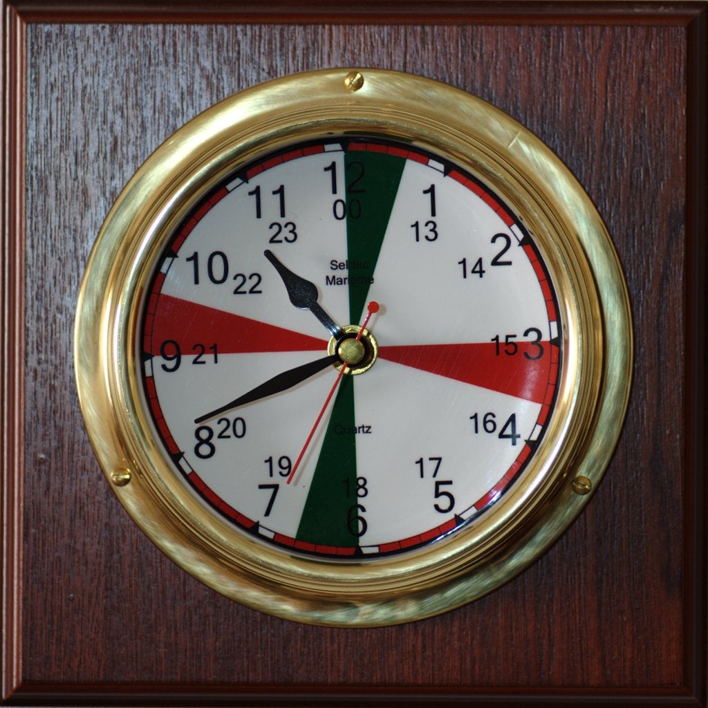 Brass marine radio room clock with red and green silence period sectors on the dial