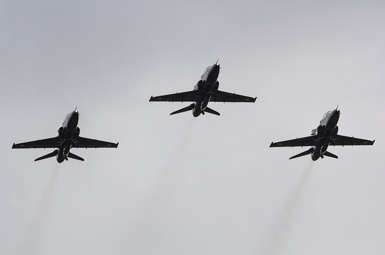 Three Royal Air Force Hawk T2 trainers in formation over RAF Valley