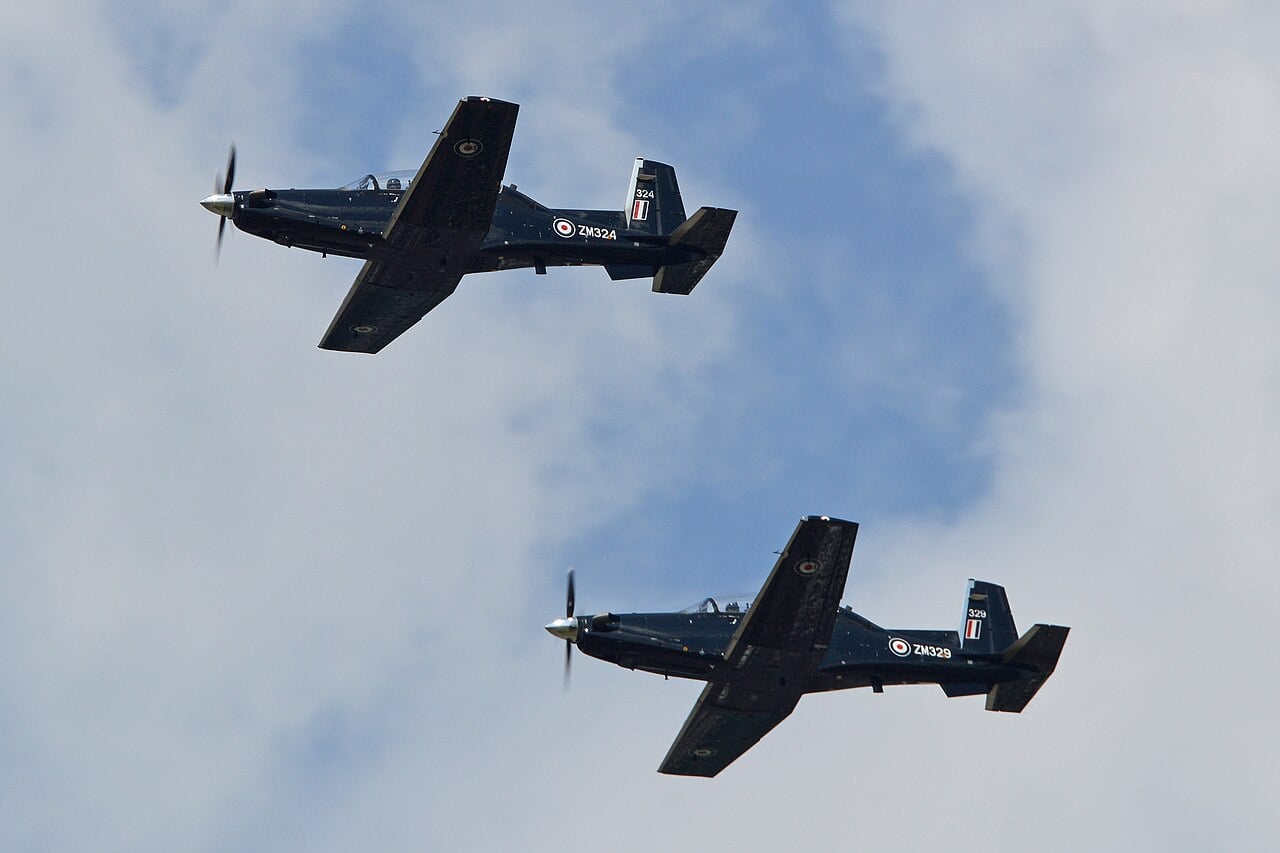 Two RAF Beechcraft Texan T1 turboprop trainers, ZM324 and ZM329, of No. 72 Squadron flying in formation