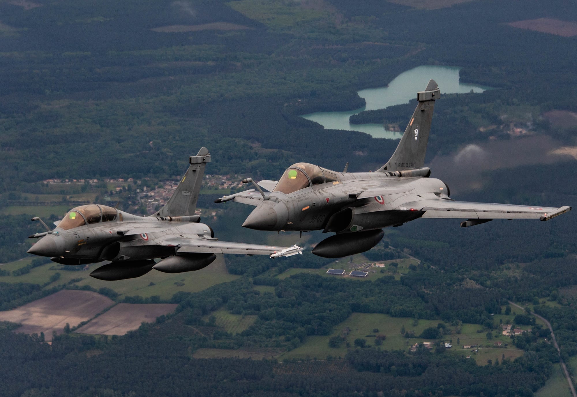 Dassault Rafales of the 1/4 Gascogne Fighter Squadron over France Two Dassault Rafale fighters of the French Air and Space Force in formation over France