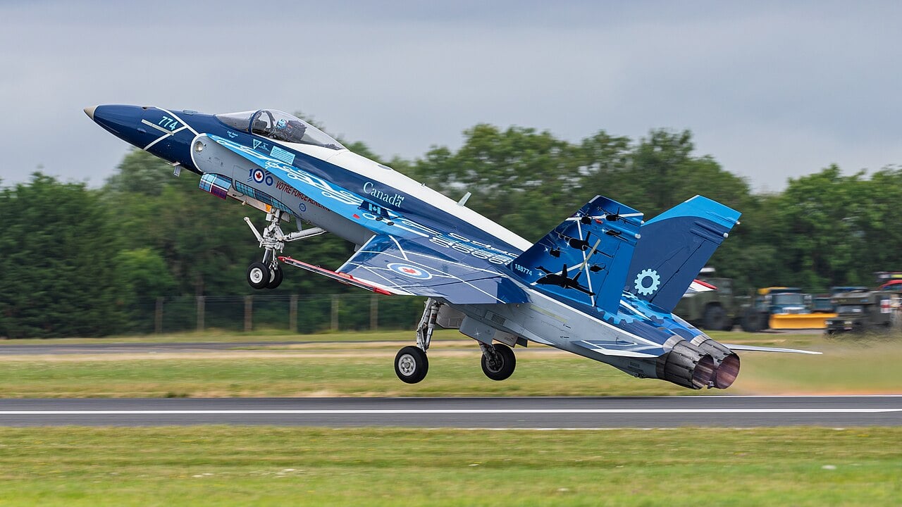 A Royal Canadian Air Force CF-188 Hornet taking off in anniversary demonstration colours