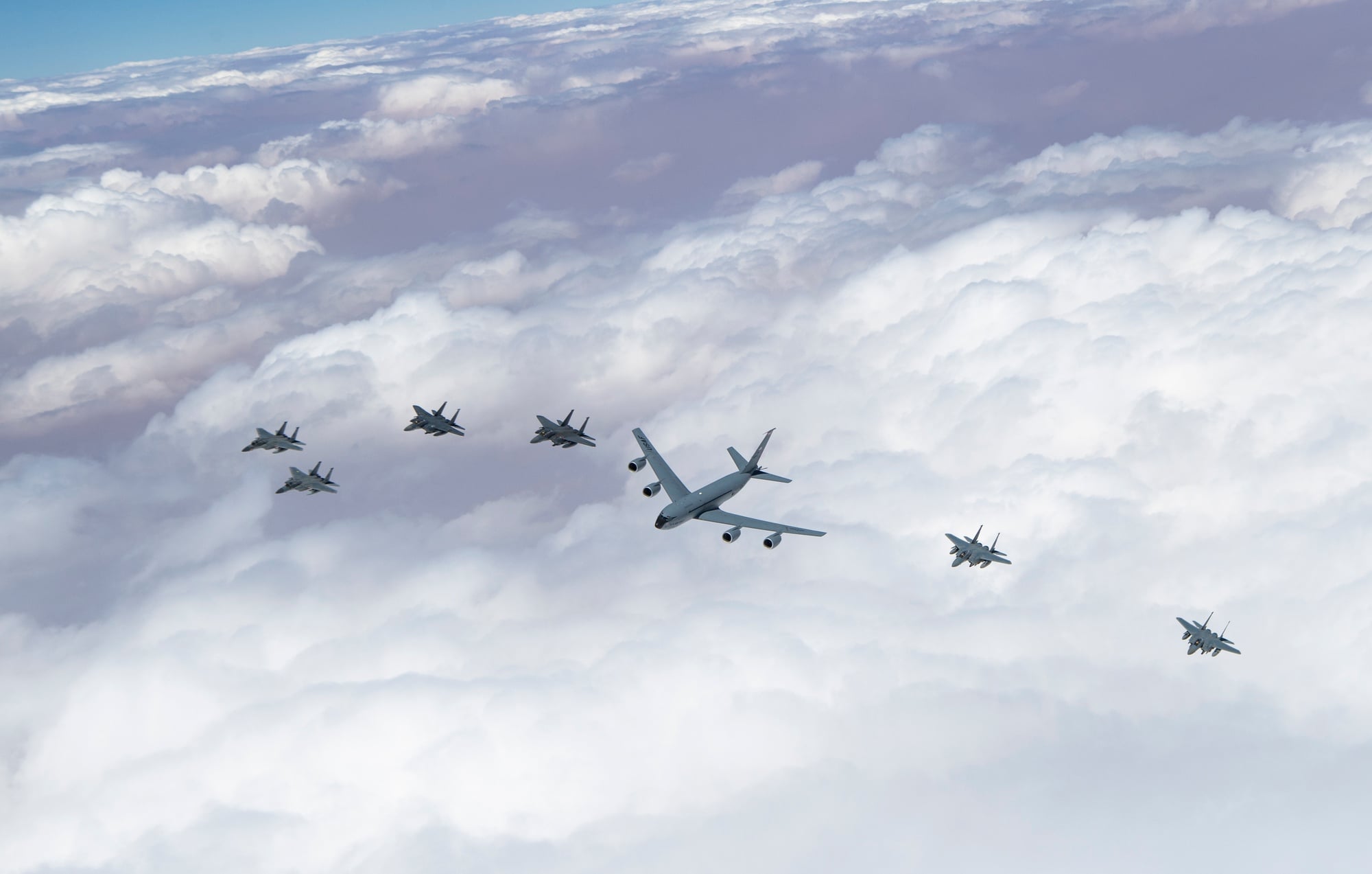 Royal Saudi Air Force F-15SA fighters flying with a US Air Force KC-135 and F-15s over Saudi Arabia