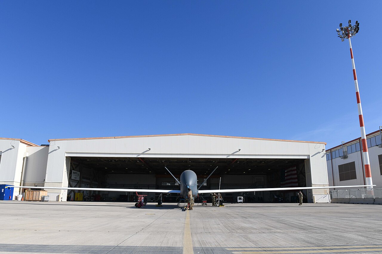 A US Air Force RQ-4 Global Hawk Block 40 outside a hangar at Sigonella