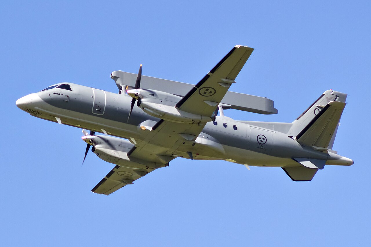 A Saab 340 AEW aircraft showing the distinctive rectangular Erieye radar fairing above the fuselage