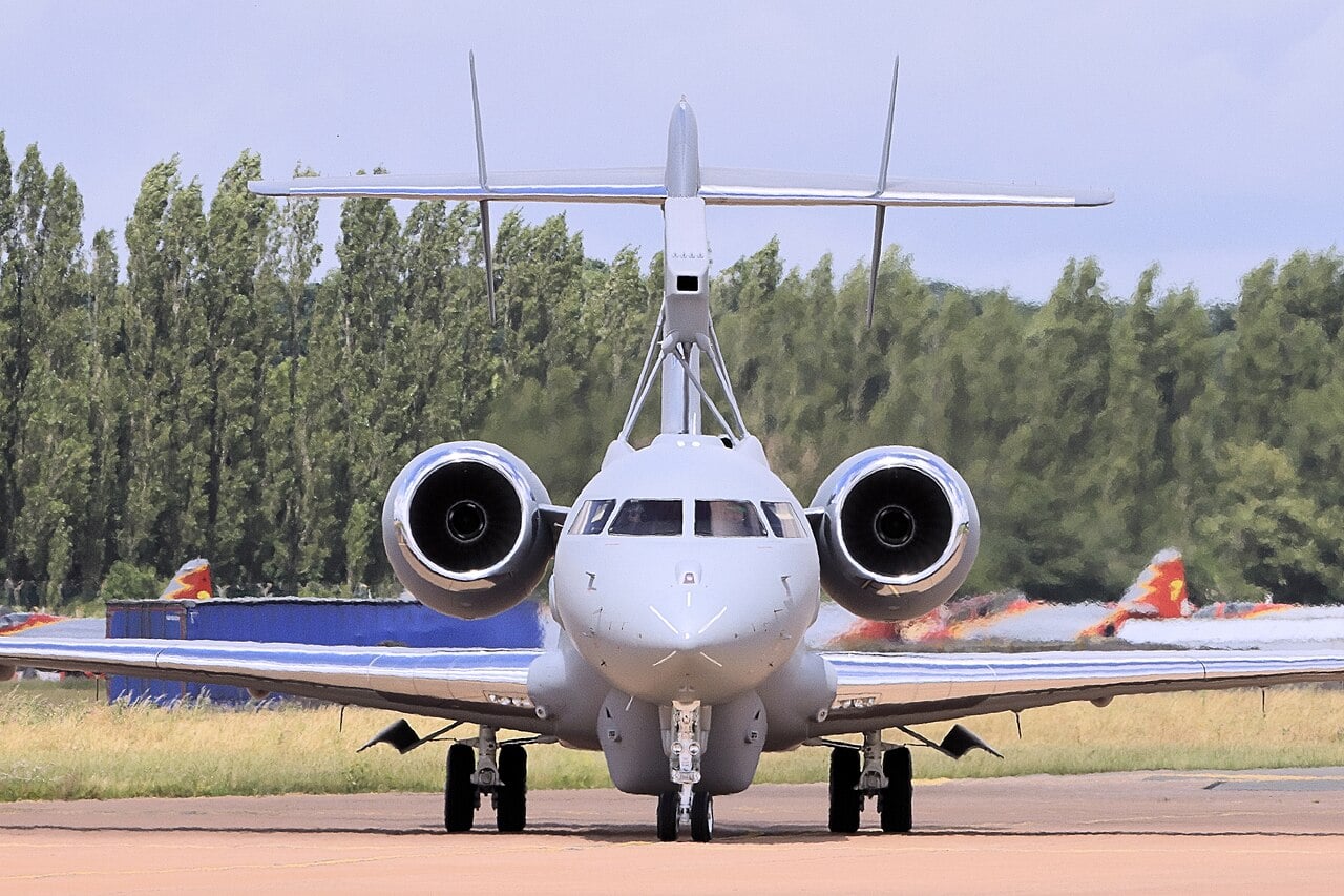 Saab GlobalEye airborne early warning and control aircraft head-on, showing the dorsal Erieye ER radar