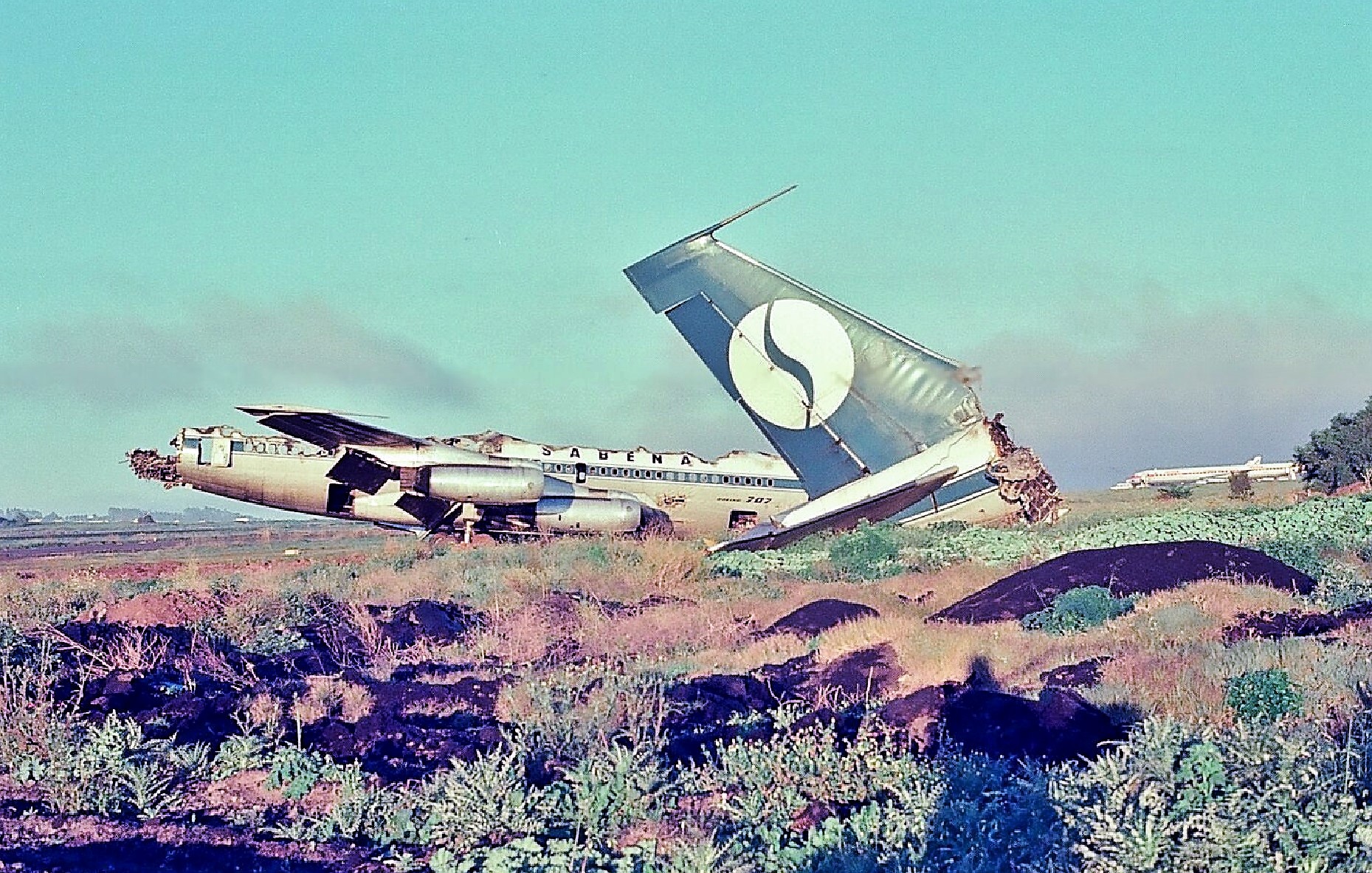 A Sabena Boeing 707-329 parked at an airport