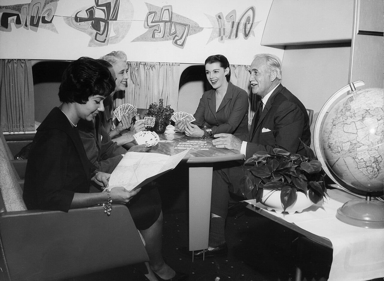 The interior of a Douglas DC-8 cabin during the era when smoking was normal