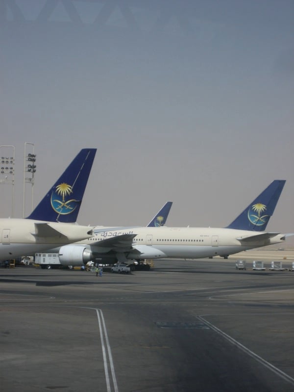 Saudi Arabian Airlines Boeing 777 tailfins parked at King Khalid International Airport in Riyadh