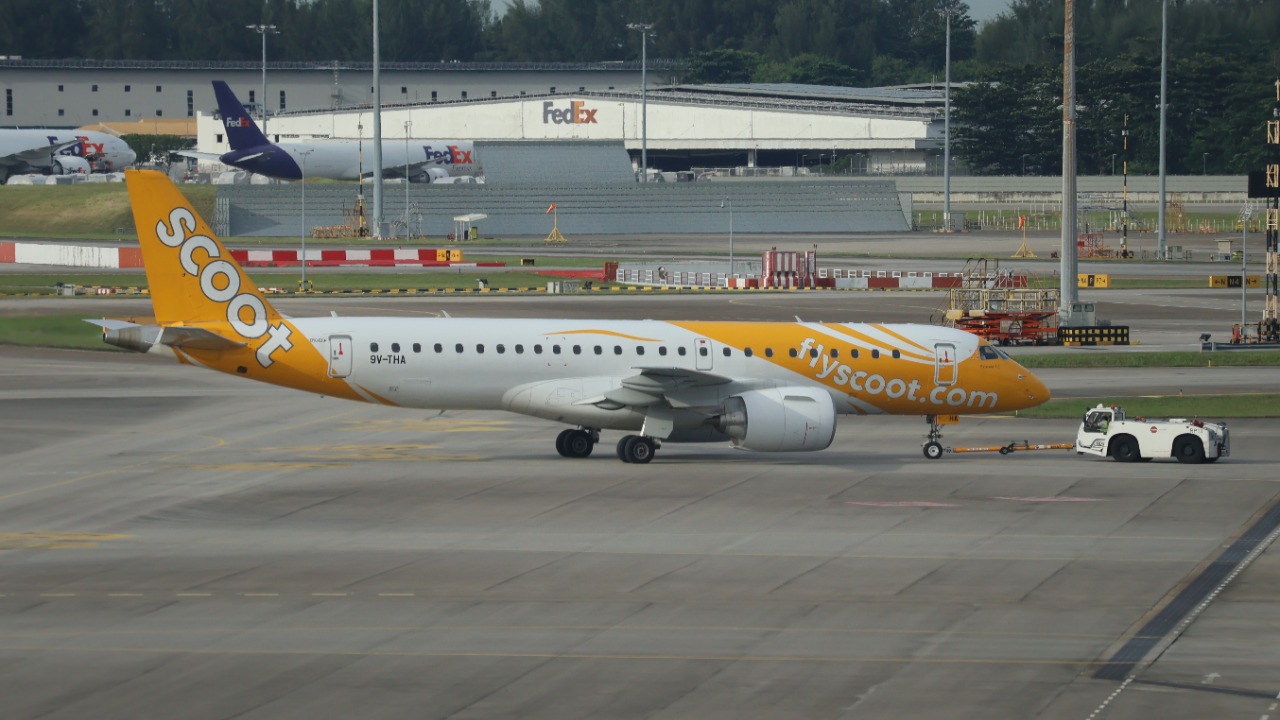 A Scoot Embraer E190-E2 registered 9V-THA at Singapore Changi Airport
