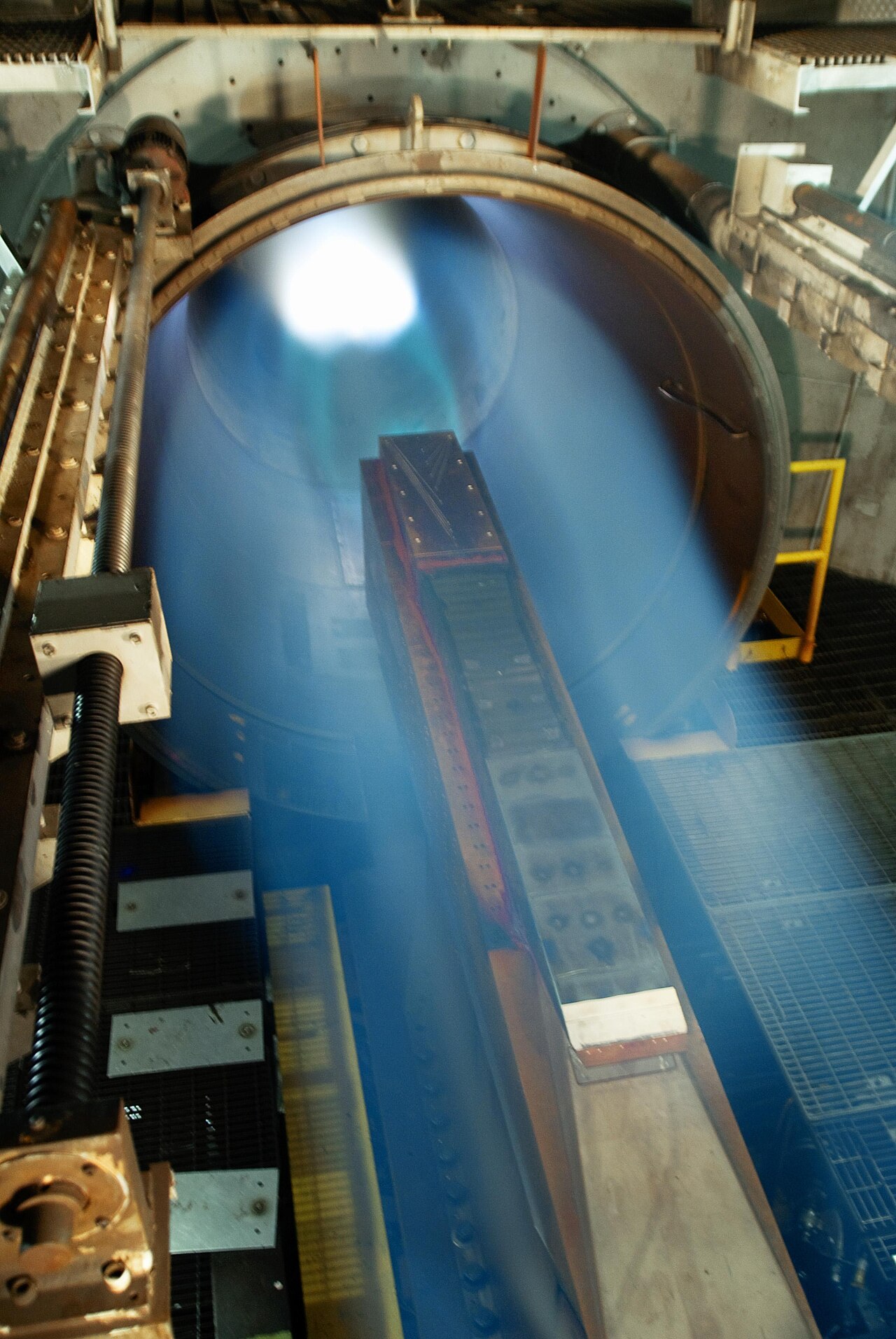 A scramjet engine undergoing ground testing at simulated Mach 5 conditions