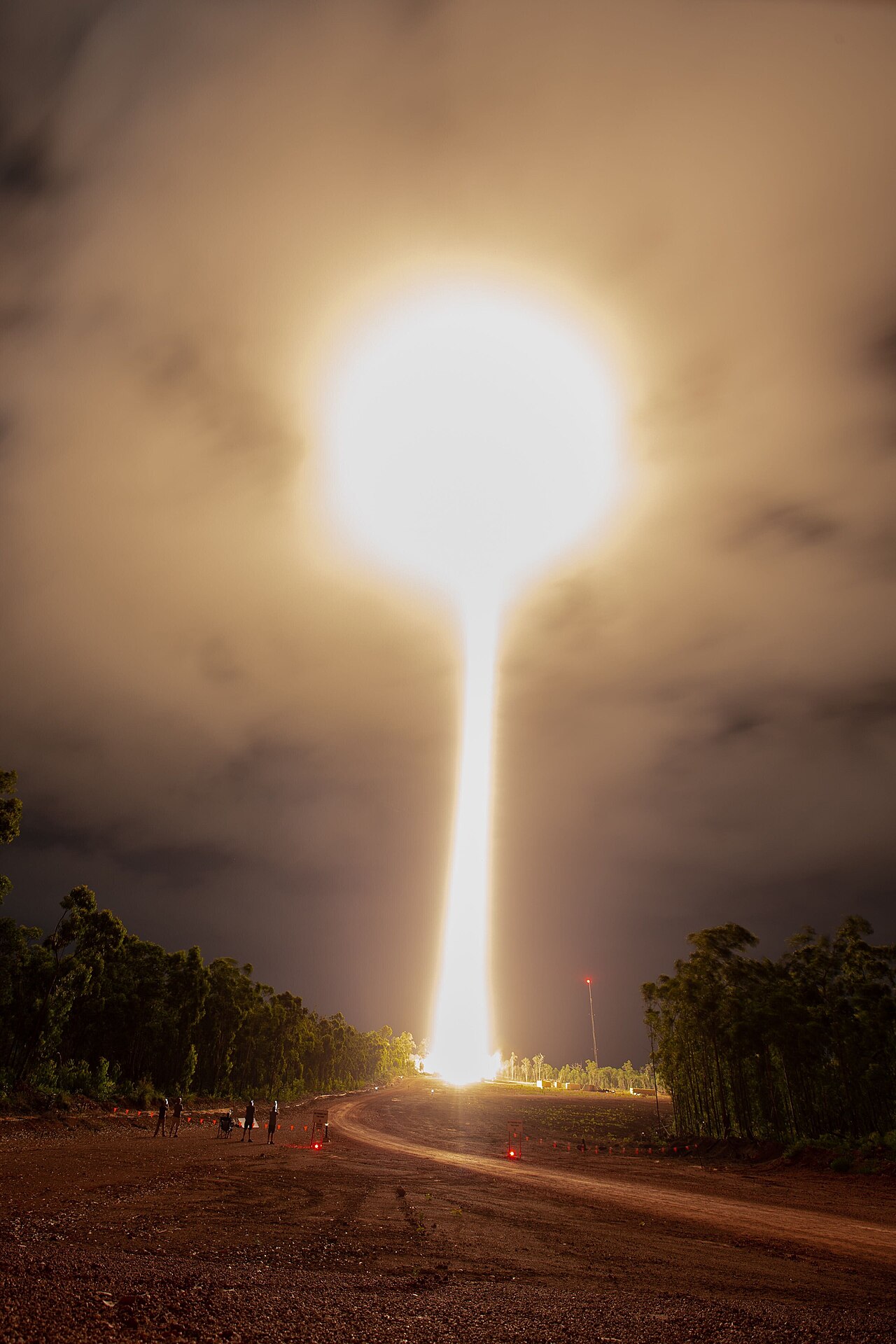 A sounding rocket lifting off at night from the Arnhem Space Centre in the Northern Territory of Australia