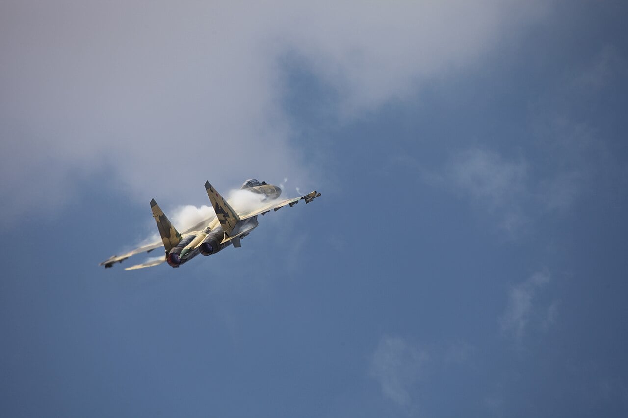 Russian Air Force Sukhoi Su-35S manoeuvring with vapour over the wings