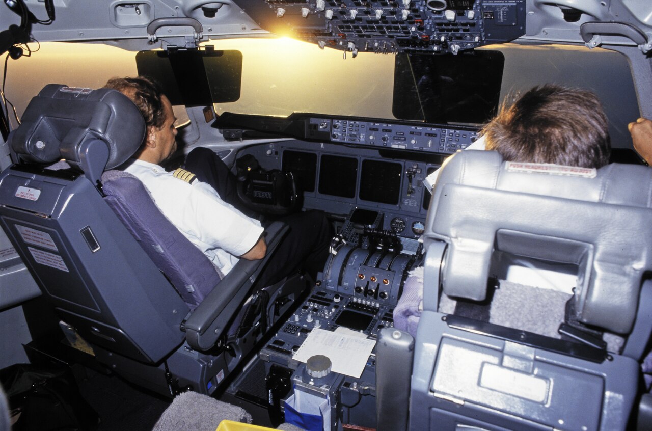 Two Swissair pilots in the cockpit of a McDonnell Douglas MD-11