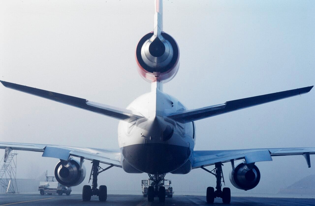 Tail of a Swissair McDonnell Douglas MD-11 on the ground in fog at Zurich-Kloten