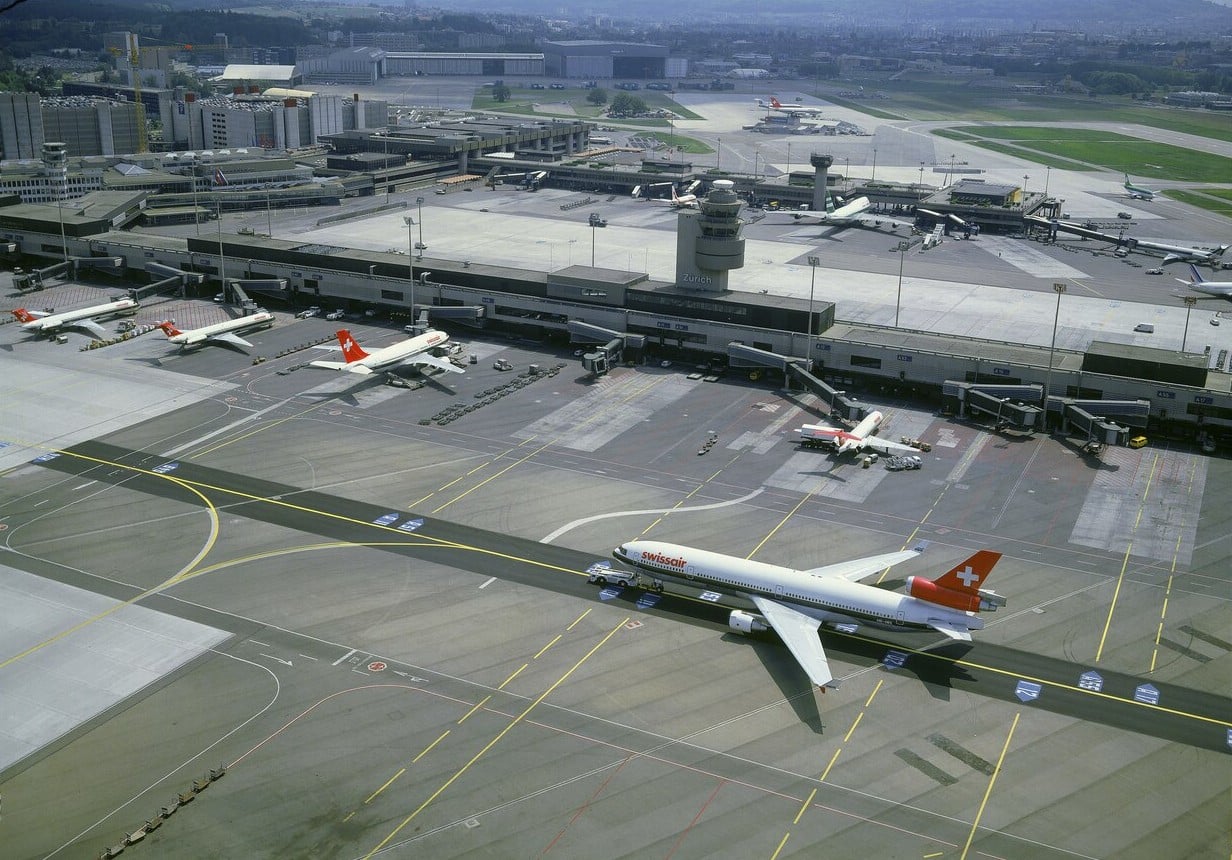 swissair-zurich-kloten-apron-1992 Aerial view of Zurich-Kloten airport in 1992 with a Swissair tri-jet taxiing past the finger dock terminals