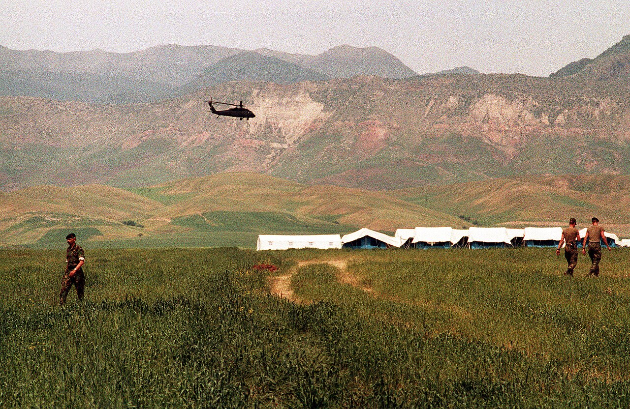 UH-60 Black Hawk over a refugee camp near Zakhu during Operation Provide Comfort, 1991