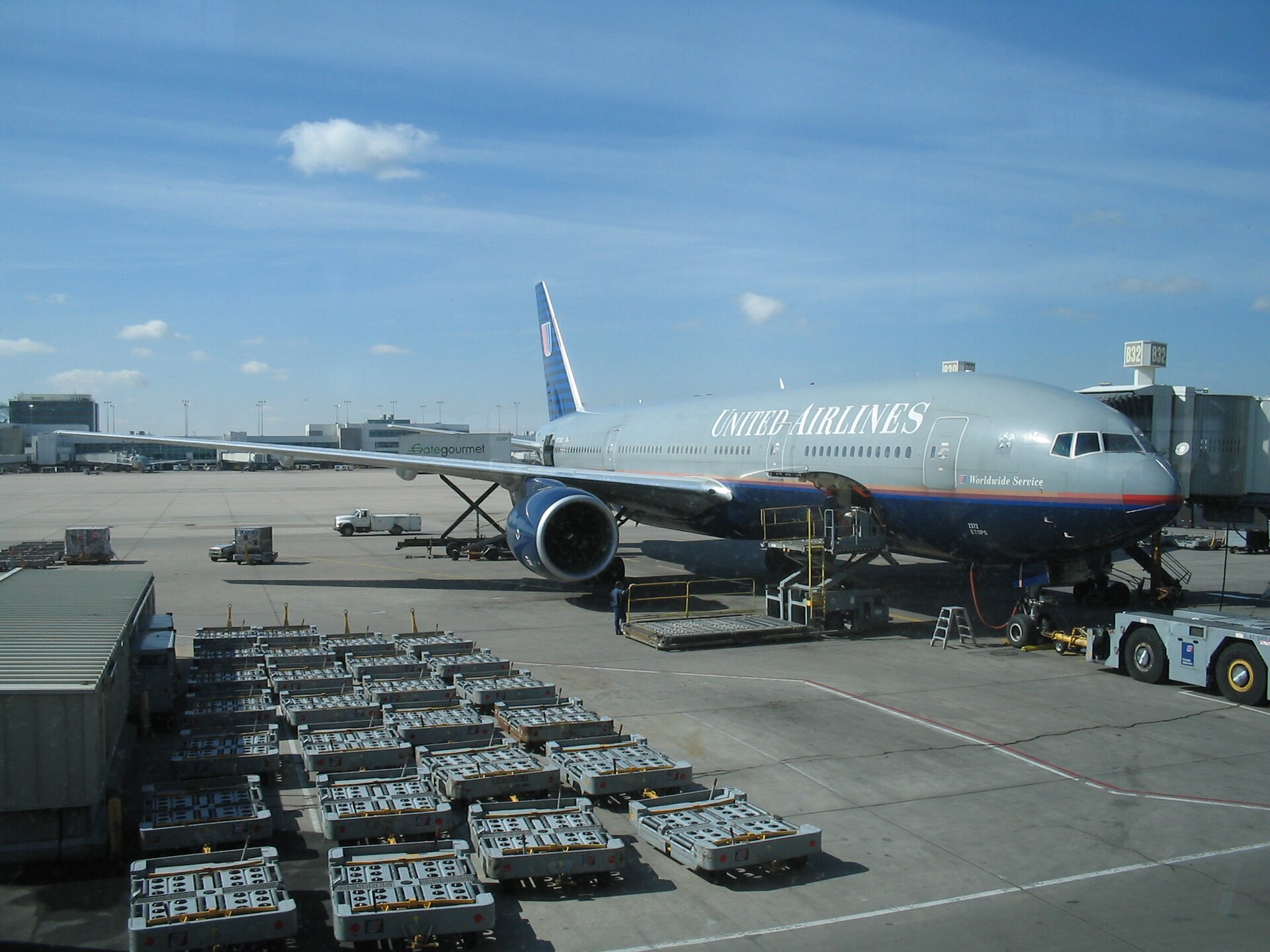 A United Airlines Boeing 777 being serviced at Denver International Airport