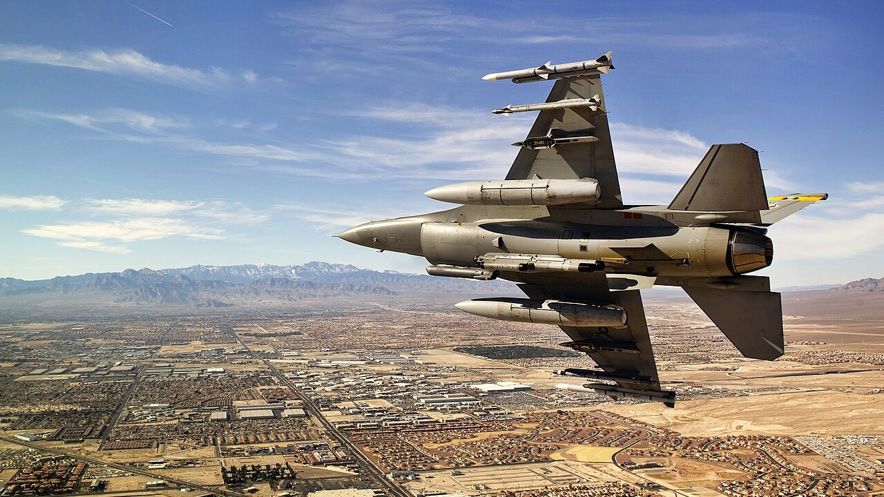 USAF F-16 Fighting Falcon over Las Vegas An armed US Air Force F-16 Fighting Falcon banking over the Las Vegas valley