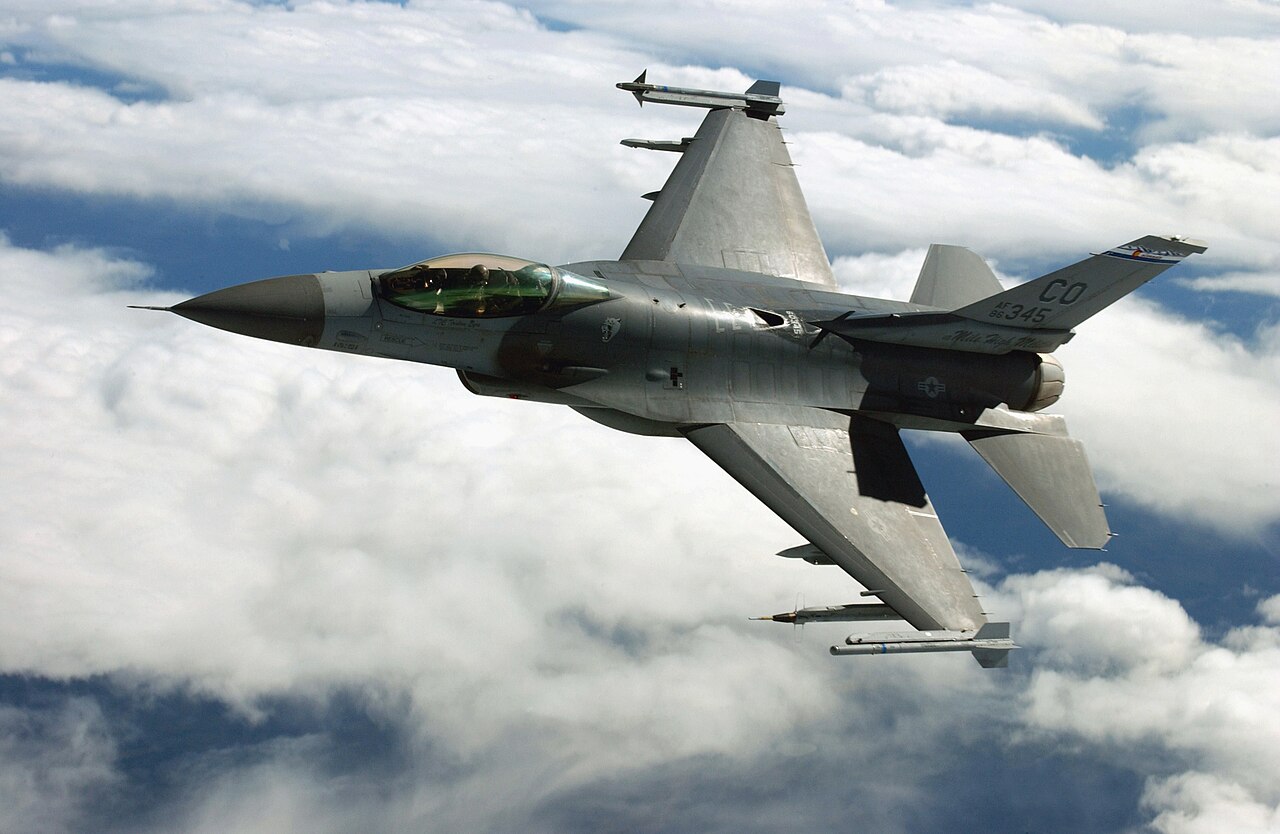 A US Air Force F-16C of the Colorado Air National Guard in flight above cloud